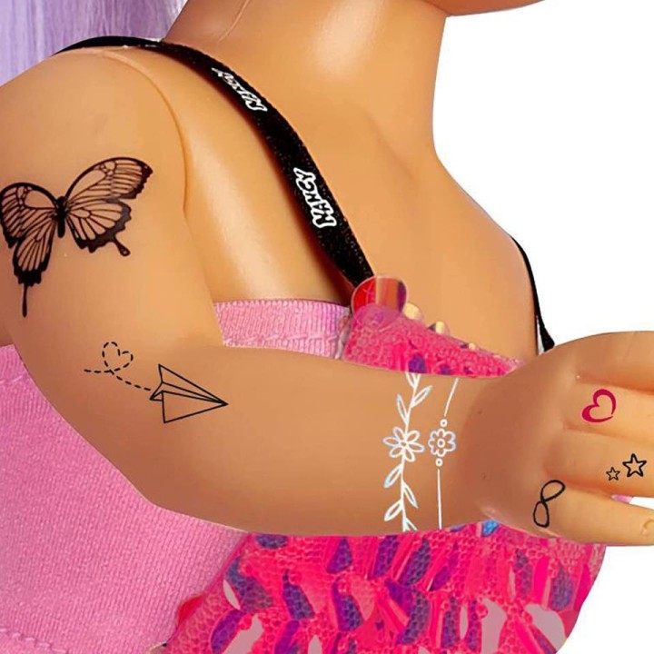NANCY CADA DIA UN TATTO 7.17335